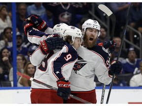 Columbus Blue Jackets left wing Artemi Panarin (9) celebrates his goal against the Tampa Bay Lightning with defenseman David Savard (58) during the third period of Game 2 of an NHL Eastern Conference first-round hockey playoff series Friday, April 12, 2019, in Tampa, Fla.