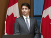 Prime Minister Justin Trudeau wait to speak to the Liberal caucus on Parliament Hill on Tuesday evening, April 2, 2019.