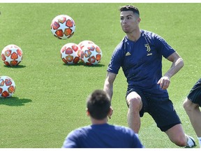 Juventus forward Cristiano Ronaldo eyes the ball during a training session on the eve of the first quarterfinal match against Ajax, in Turin, Italy, April 9, 2019.