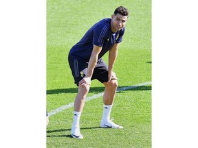 Juventus forward Cristiano Ronaldo looks at teammates during a training session ahead of Tuesday's Champions League, quarter final second leg soccer match between Juventus and Ajax, at the Juventus training center, near Turin, Italy, Monday, April 15, 2019.
