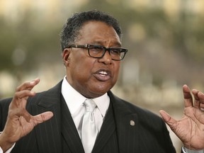 FILE - In this Feb. 19, 2018 file photo, former Dallas city council member Dwaine Caraway, speaks during a news conference in Dallas. Dallas Mayor Pro Tem Caraway accepted more than $450,000 in kickbacks and bribes, in part through a phony consulting agreement, gambling money and trips to Las Vegas and elsewhere, federal prosecutors said Thursday April 4, 2019. Caraway, the second highest-ranking elected official in Dallas, pleaded guilty to two federal charges in the public corruption case and has resigned from the Dallas City Council.
