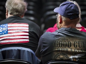 FILE - In this May 4, 2018, file photo, people in the audience wait for the start of the National Rifle Association-Institute for Legislative Action Leadership Forum at the Kay Bailey Hutchison Convention Center in Dallas. The National Rifle Association is gathering for its 148th annual meeting beginning Thursday, April 25, 2019, in Indianapolis.