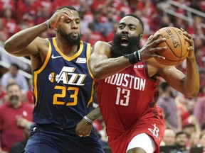 Houston Rockets guard James Harden (13) drives against Utah Jazz forward Royce O'Neale (23) during the first half of Game 2 of a first-round NBA basketball playoff series in Houston, Wednesday, April 17, 2019.
