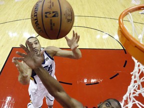 Utah Jazz center Rudy Gobert, left, and Houston Rockets guard Chris Paul (3) reach for a rebound during the first half of Game 5 of a first-round NBA basketball playoff series in Houston, Wednesday, April 24, 2019.