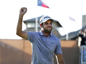 Corey Conners celebrates after sinking a putt on the 18th hole to win the Texas Open golf tournament, Sunday, April 7, 2019, in San Antonio.