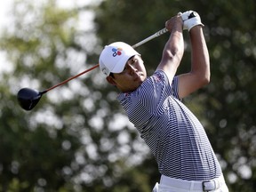 Si Woo Kim hits watches a shot on the 15th hole during the second round of the Valero Texas Open golf tournament Friday, April 5, 2019, in San Antonio.