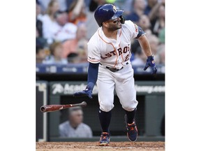 Houston Astros' Jose Altuve watches his solo home run off New York Yankees starting pitcher Masahiro Tanaka during the fourth inning of a baseball game, Monday, April 8, 2019, in Houston.