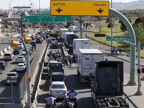 Cars and trucks line up to enter Mexico from the U.S. at a border crossing in El Paso, Texas, Friday, March 29, 2019. Threatening drastic action against Mexico, President Donald Trump declared on Friday he is likely to shut down America's southern border next week unless Mexican authorities immediately halt all illegal immigration. Such a severe move could hit the economies of both countries, but the president emphasized, "I am not kidding around."