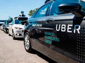 In this file photo taken on September 13, 2016, pilot models of the Uber self-driving car are displayed at the Uber Advanced Technologies Center in Pittsburgh, Pennsylvania.