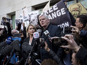 Kristinn Hrafnsson, editor in chief of WikiLeaks, center, and Jennifer Robinson, barrister, center left, speak outside the Westminster Magistrates' Court in London on April 11.