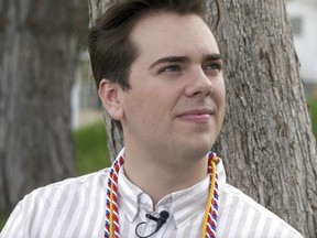 Matt Easton poses for a photograph as he sits in a park Monday, April 29, 2019, in Cottonwood Heights , Utah. Easton, A gay student who came out during a valedictorian speech at Mormon-owned Brigham Young University is earning applause and admiration from fellow students and figures like actress Kristin Chenoweth and the husband of gay Democratic presidential candidate Pete Buttigieg.