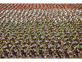 FILE - In this Sept. 22, 2014 file photo, members of the Iran's Revolutionary Guard march during an annual military parade at the mausoleum of Ayatollah Khomeini, outside Tehran, Iran. On Monday, April 8, 2019, the Trump administration designated Iran's Revolutionary Guard a "foreign terrorist organization" in an unprecedented move against a national armed force. Iran's Revolutionary Guard Corps went from being a domestic security force with origins in the 1979 Islamic Revolution to a transnational fighting force.