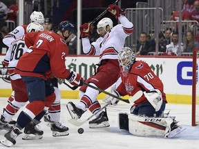 Carolina Hurricanes center Jordan Staal, center, battles for the puck against Washington Capitals goaltender Braden Holtby (70) and defenseman Matt Niskanen (2) during the first period of Game 7 of an NHL hockey first-round playoff series, Wednesday, April 24, 2019, in Washington. Also seen is Hurricanes left wing Teuvo Teravainen (86).