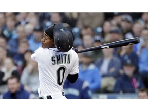 Seattle Mariners' Mallex Smith loses his batting helmet as he swings and misses to strike out against the Houston Astros in the first inning of a baseball game Saturday, April 13, 2019, in Seattle.