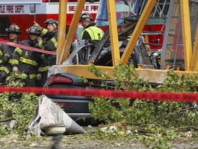 A construction crane working on a building collapsed near the intersection of Mercer Street and Fairview Avenue near Interstate 5, Saturday, April 27, 2019, in downtown Seattle. Authorities say several people have died and a few others are hospitalized after the construction crane fell onto a street pinning cars underneath Saturday afternoon.