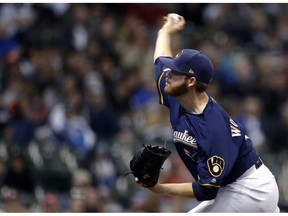 Milwaukee Brewers' Brandon Woodruff pitches during the first inning of the team's baseball game against the St. Louis Cardinals on Tuesday, April 16, 2019, in Milwaukee.