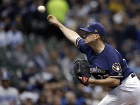 Milwaukee Brewers' Zach Davies pitches during the first inning of the team's baseball game against the Los Angeles Dodgers on Thursday, April 18, 2019, in Milwaukee.