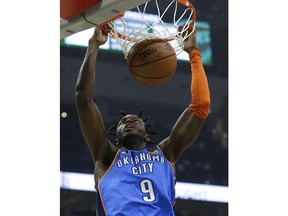 Oklahoma City Thunder's Jerami Grant dunks during the first half of an NBA basketball game against the Milwaukee Bucks Wednesday, April 10, 2019, in Milwaukee.