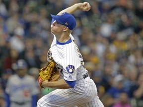 Milwaukee Brewers starting pitcher Chase Anderson throws to the Los Angeles Dodgers during the first inning of a baseball game Saturday, April 20, 2019, in Milwaukee.