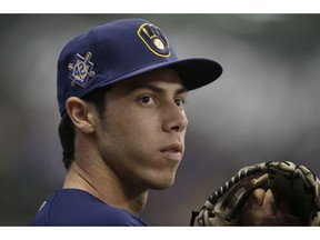 Milwaukee Brewers' Christian Yelich looks on during Jackie Robinson Day during a baseball game against the St. Louis Cardinals, Monday, April 15, 2019, in Milwaukee.