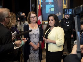 Jody Wilson-Raybould, right, and Jane Philpott speak to reporters on Parliament Hill on April 3, 2019, a day after being removed from the Liberal caucus.