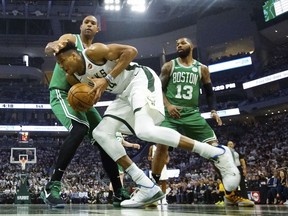 Milwaukee Bucks' Giannis Antetokounmpo tries to drive past Boston Celtics' Al Horford during the first half of Game 2 of a second round NBA basketball playoff series Tuesday, April 30, 2019, in Milwaukee.