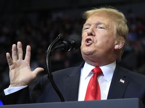 In this March 28, 2019 photo, President Donald Trump speaks at a campaign rally in Grand Rapids, Mich. Trump is suggesting he will defer until after 2020 his push for a Republican health care plan to replace the Affordable Care Act. Trump tweeted late Monday that Congress will vote on a GOP plan after the elections, "when Republicans hold the Senate & win back the House."