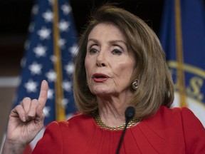 FILE - In this April 4, 2019 file photo, Speaker of the House Nancy Pelosi, D-Calif., speaks during a news conference on Capitol Hill in Washington.  Pelosi and Senate Minority Leader Chuck Schumer are to meet with Trump at the White House on Tuesday.