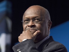 FILE - In this June 20, 2014 file photo, Herman Cain, CEO, The New Voice, speaks during Faith and Freedom Coalition's Road to Majority event in Washington. Trump says Herman Cain withdraws from consideration for Fed seat amid focus on past allegations.
