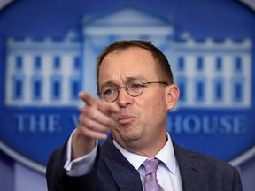 In this March 22, 2018 file photo, Office of Management and Budget Director Mick Mulvaney speaks in the Brady press briefing room at the White House in Washington. Mulvaney says he expects to stay on in his role though the 2020 election.