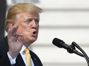 In this April 25, 2019, photo, President Donald Trump speaks on the South Lawn of the White House in Washington.