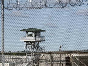 FILE - In this April 16, 2018, file photo, a guard tower stands above the Lee Correctional Institution, a maximum security prison in Bishopville, S.C. The Democrats running for the White House have issued proposals on overhauling education, agriculture, technology and immigration. But none of them has made specific pitches on how he or she would transform the nation's criminal justice system.