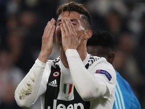Juventus' Cristiano Ronaldo reacts after missing a scoring chance during the Champions League quarter final, second leg soccer match between Juventus and Ajax, at the Allianz stadium in Turin, Italy, Tuesday, April 16, 2019.