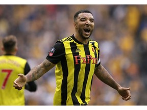 Watford's Troy Deeney celebrates after scoring his side's second goal during the English FA Cup semifinal soccer match between Watford and Wolverhampton Wanderers at Wembley Stadium in London, Sunday, April 7, 2019.