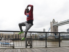 Britain's Mo Farah leaps as he poses for the media during a photo call for the London Marathon in London, Wednesday, April 24, 2019. Farah will take part in the 39th London Marathon which takes place Sunday April 28.