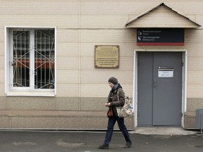 A woman walks past the Memorial plaque in memory of North Korean leader Kim Jong Il's visit to Russia in 2002, at the Okeanskaya railway station where North Korean leader Kim Jong Un is expected to make his first stop before his summit with Russian President Vladimir Putin, in the border at Russia's Far East, Tuesday, April 23, 2019.North Korea on Tuesday confirmed that leader Kim Jong Un will soon visit Russia to meet with Putin in a rare summit.