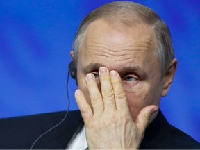 Russian President Vladimir Putin gestures as he attends a plenary session of the International Arctic Forum in St. Petersburg, Russia, Tuesday, April 9, 2019.