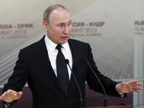 Russian President Vladimir Putin gestures while speaking to the media after his talks with North Korea's leader Kim Jong Un talk in Vladivostok, Russia, Thursday, April 25, 2019. President Vladimir Putin says after talks with North Korean leader Kim Jong Un that Pyongyang is ready to proceed toward denuclearization, but that it needs serious security guarantees to do so.