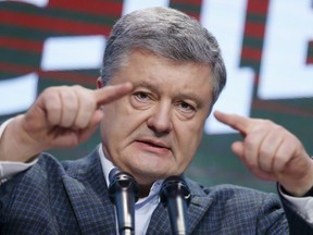 Ukrainian President Petro Poroshenko gestures while speaking at his headquarters after the presidential election in Kiev, Ukraine, Sunday, March 31, 2019. The exit poll released Sunday after voting stations closed indicated that Zelenskiy received about 30.4 percent of the nationwide vote, followed by incumbent President Petro Poroshenko with 17.8 percent and former Prime Minister Yulia Tymoshenko with 14.2 percent support.