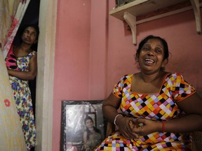 A 52-year-old Buddhist factory worker Anoma Damayanthi weeps as she talks about her 25-year-old daughter, married into a Christian family, who was seriously injured in the blast at St. Anthony's Church on Easter Sunday, at her residence in Colombo, Sri Lanka, Thursday, April 25, 2019. Liyanage herself was at St. Anthony's, and escaped the bomb only because she left a few minutes earlier with her Christian son-in-law when her 1 and a half-year-old granddaughter began crying too loudly.
