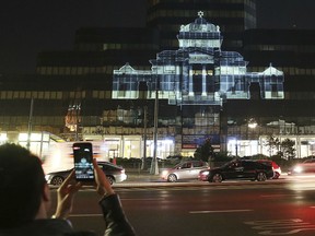 The Great Synagogue of Warsaw, which was destroyed by the German forces during World War II, was recreated virtually with light as part of anniversary commemorations of the 1943 uprising in the Warsaw Ghetto, in Warsaw, Poland, Thursday, April 18, 2019. The multimedia installation, which included the archival recordings of a prewar cantor killed in the Holocaust, is the work of Polish artist Gabi von Seltmann. It was organized by a group that fights anti-Semitism.