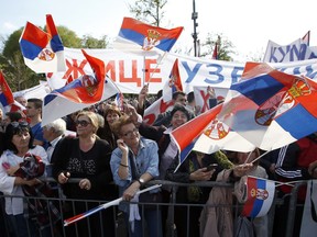 Supporters of Serbian President Aleksandar Vucic wave flags during ''The Future of Serbia'' major rally to counter months of anti-government protests demanding his resignation, free elections and media freedoms, in Belgrade, Serbia, April 19, 2019.