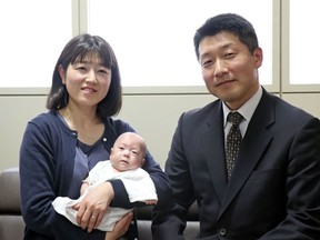 Ryusuke Sekino, a 5-month-old boy who was just 258 grams (9 ounces) when born, sits in the arms of his mother Toshiko Sekino, accompanied by his father Kohei Sekino, right, at a hospital in Azumino, Nagano Prefecture, central Japan, Friday, April 19, 2019. The baby is among the tiniest baby boys to survive in the world.