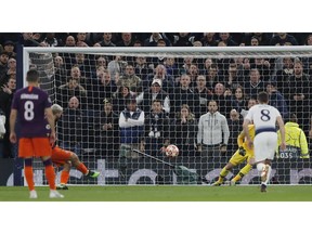 Tottenham's goalkeeper Hugo Lloris, right, saves on a penalty kick by Manchester City's Sergio Aguero during the Champions League, round of 8, first-leg soccer match between Tottenham Hotspur and Manchester City at the Tottenham Hotspur stadium in London, Tuesday, April 9, 2019.