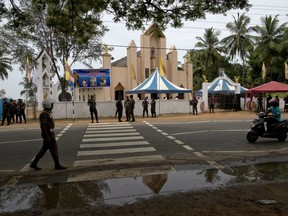 Soldiers guard outside St. Joseph's church, Tuesday, April 30, 2019, in Thannamunai, Sri Lanka. This small village in eastern Sri Lanka has held likely the first Mass since Catholic leaders closed all their churches for fear of more attacks after the Easter suicide bombings that killed over 250 people.