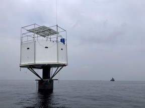 This Saturday, April 13, 2019, photo provided by Royal Thai Navy, shows a floating home lived in by an American man and his Thai partner in the Andaman Sea, off Phuket island, Thailand. Thai authorities raided Thursday, April 18, 2019, the floating home lived in by the couple who sought to be pioneers in the seasteading movement, which promotes living in international waters to be free of any nation's laws. Thailand's navy claims they endangered national sovereignty, an offense punishable by life imprisonment or death. (Royal Thai Navy via AP)