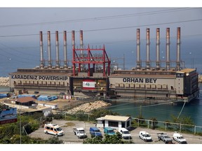 The Turkish floating power station Karadeniz Powership Orhan Bey, which generates electricity to help ease the strain on the country's woefully under maintained power sector, is docked near the Jiyeh power plant, south of Beirut, Lebanon, Monday, April 8, 2019. Lebanon's Cabinet has approved a much-anticipated plan to restructure Lebanon's electricity sector, decrepit since the country's civil war more than 40 years ago. Lebanese Prime Minister Saad Hariri said Monday the new plan will eventually provide the country's more than 5 million people with 24-hour electricity.