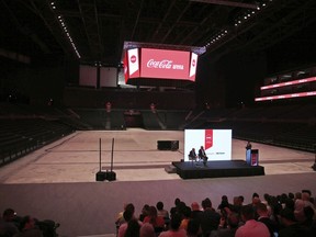 In this Tuesday, April 16, 2019 photo, Journalists take part at press conference with spokespersons from Meraas, Coca-Cola and AEG Ogden, at the Coca Cola Arena in Dubai, United Arab Emirates. Dubai unveils its latest mega-project, a stadium and arena in the heart of a super luxe shopping and dining destination, even as the economy slows down and thousands of jobs are being axed across the emirate.