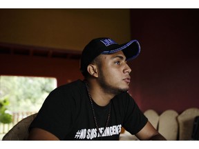 FILE - In this July 28, 2018 file photo, Jairo Bonilla, leader of the April 19 student movement, wearing a T-shirt designed with a hashtag that reads in Spanish: "We are not criminals," during an interview in Managua, Nicaragua. "For us as exiles there is no guarantee that we could return and nothing would happen to us." said Bonilla, Monday, 15, 2019 who now lives in Costa Rica, in response to Nicaragua's government announcement that it will implement a program to guarantee the safe return of exiles.