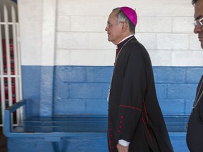 FILE - In this May 6, 2018 file photo, Managua's auxiliary Roman Catholic Bishop Silvio Báez arrives at the Sacred Heart church in Managua, Nicaragua. Báez, an outspoken critic of Nicaraguan President Daniel Ortega has left on Tuesday, April 23, 2019, for the Vatican after being called there indefinitely by Pope Francis.